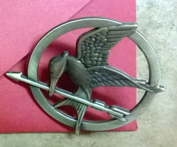 Amazon.com  The Hunger Games Bronze Mockingjay Pin Brooch  Toys   Games