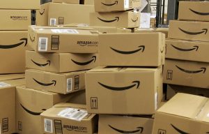 FILE - This Dec. 13, 2005 file photo shows stacks of Amazon.com boxes with merchandise for shipment, at the Amazon.com fulfillment center in Fernley, Nevada. Amazon.com Inc. has signed a deal Monday, Sept. 26, 2011, to stream Fox movies and TV shows to members of its Amazon Prime premium shipping program. (AP Photo/Ben Margot, File)